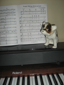 Turns out Dog had a hard time playing the piano. Though he did enjoy listening and singing along to some broadway classics.  That is what happens when you are made of porcelain and don't have opposable thumbs.
